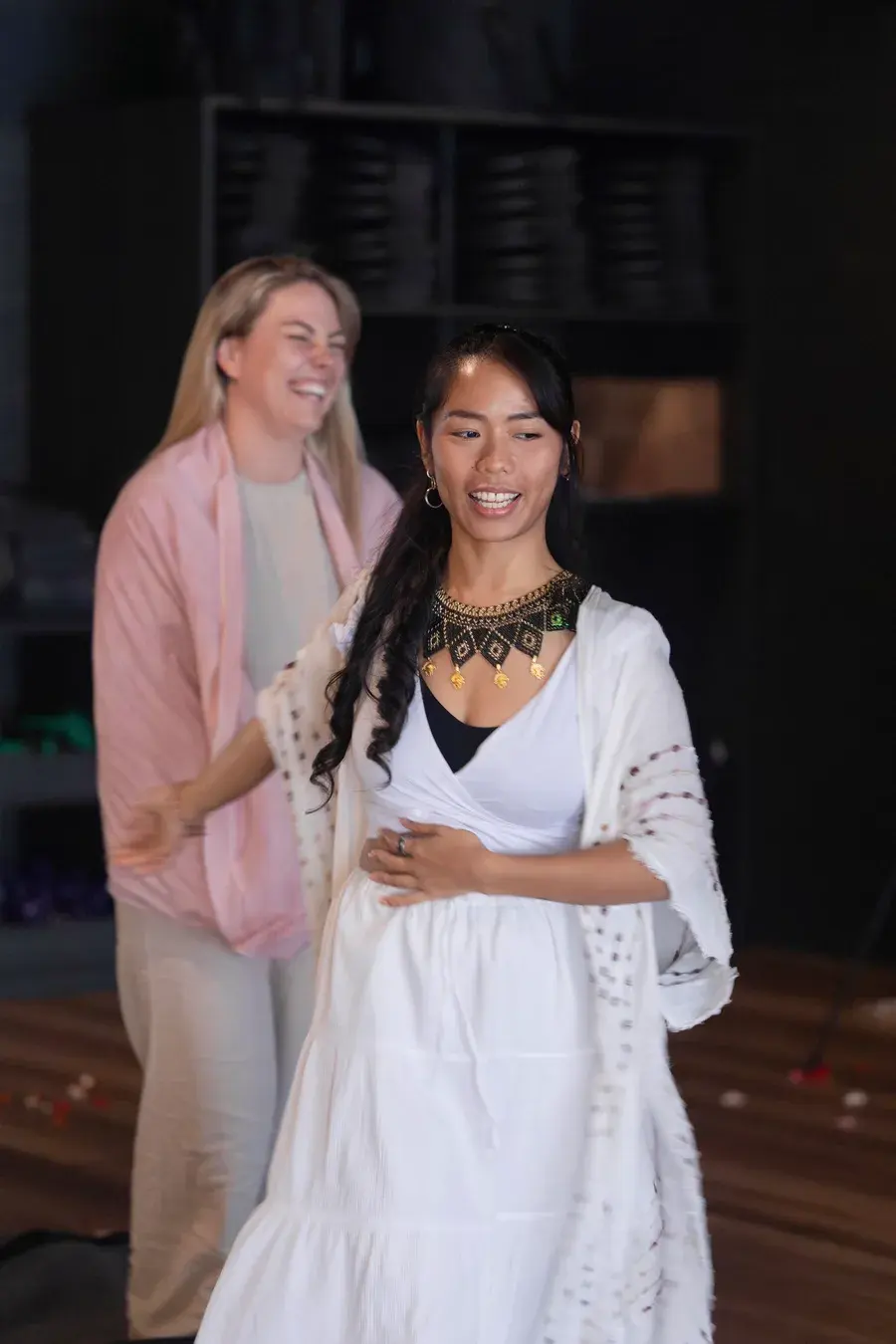 Two participants laughing together