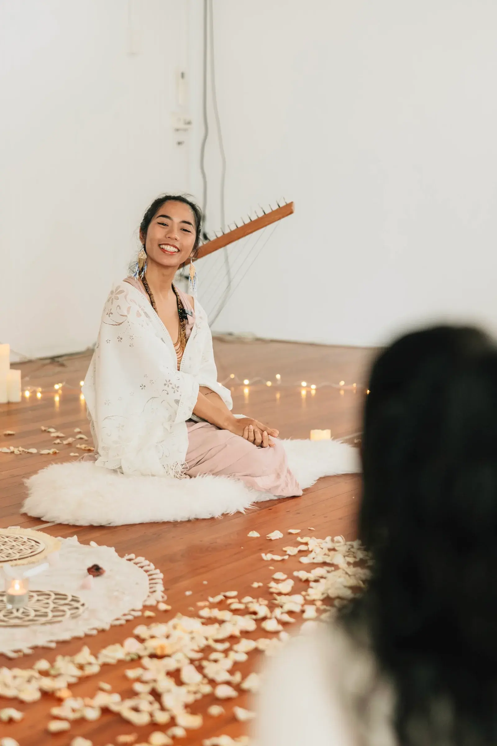 Sarah laughing with participants in her Gold Coast room