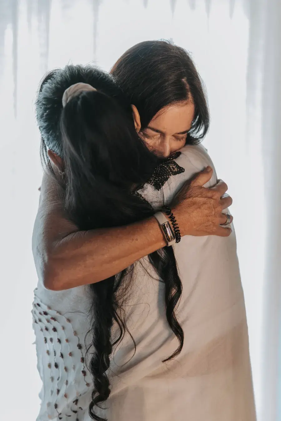 Sarah embracing a participant