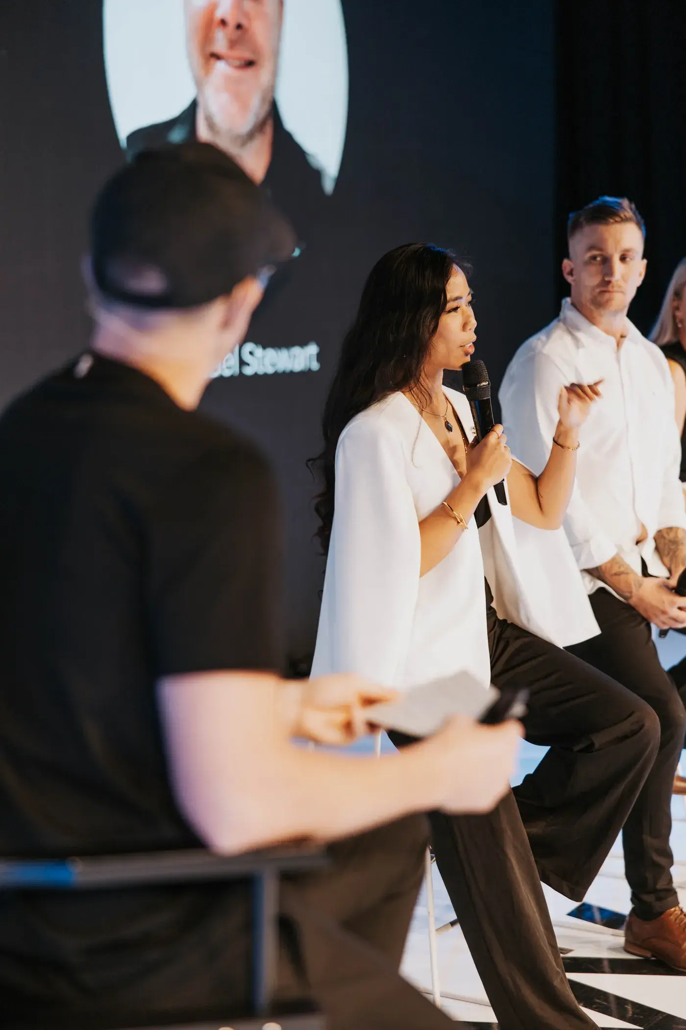 Sarah speaking on stage at Dreamfest